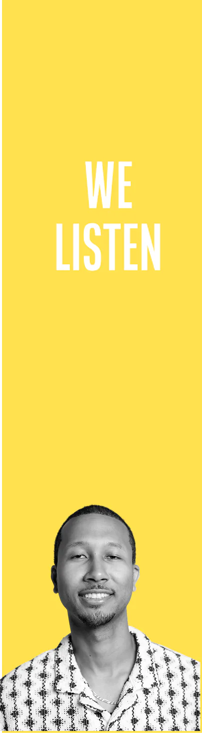 Smiling man with short hair and a trimmed beard wearing a patterned shirt and a necklace, below the text 'WE LISTEN' on a yellow background.